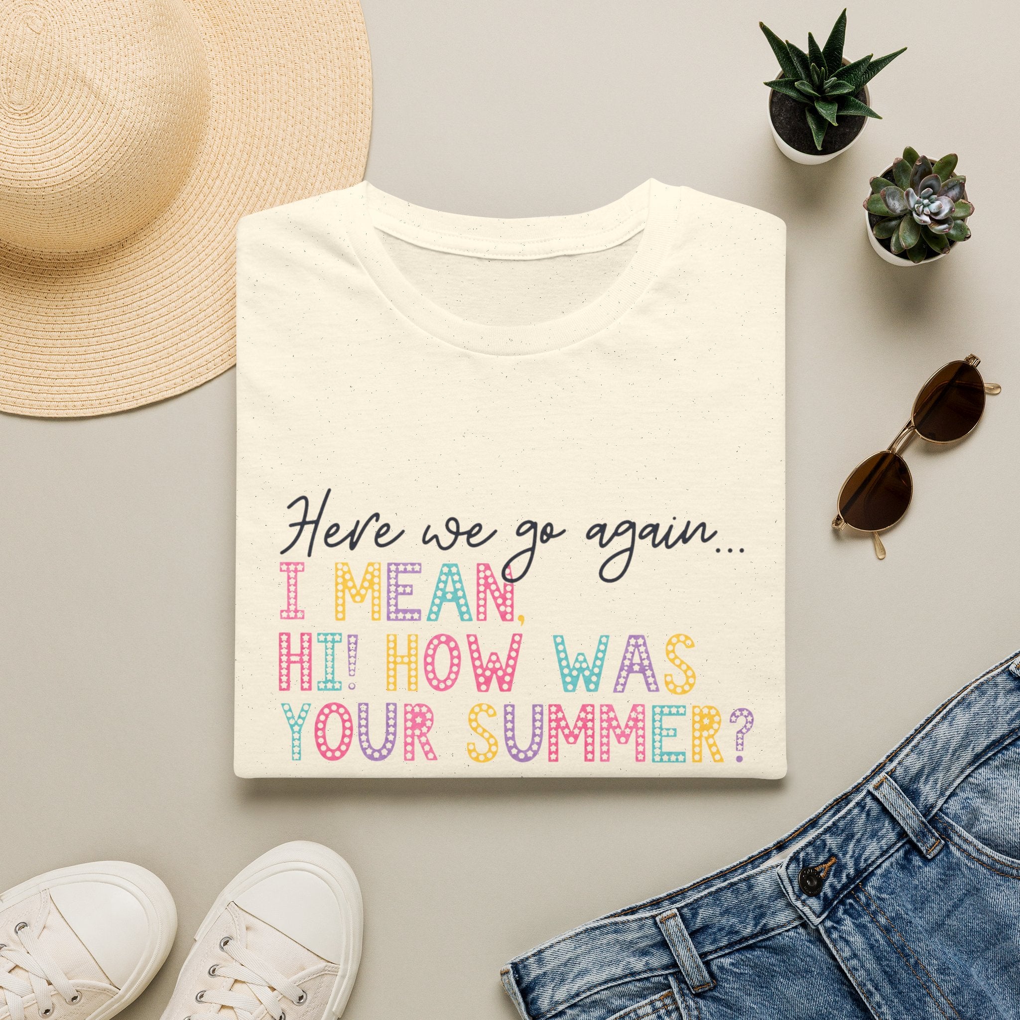 T-Shirt — "Here We Go Again… I Mean Hi! How Was Your Summer?" Playful Pastel Summer Reunion Tee